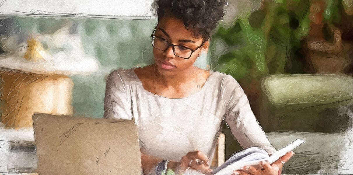 Focused,Young,African,American,Businesswoman,Or,Student,Looking,At,Laptop